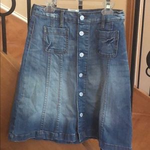 LOGG Jean skirt with six labeled buttons.
